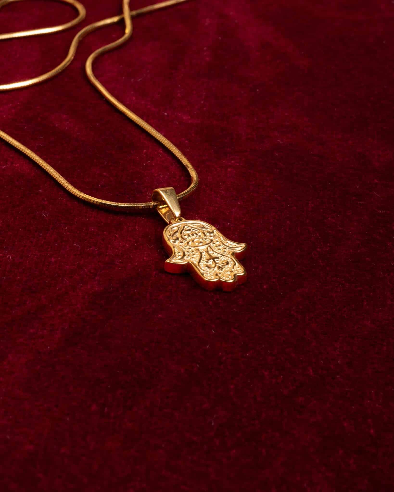 Fathimas hand guld snake guldhalsband från KAGAMI