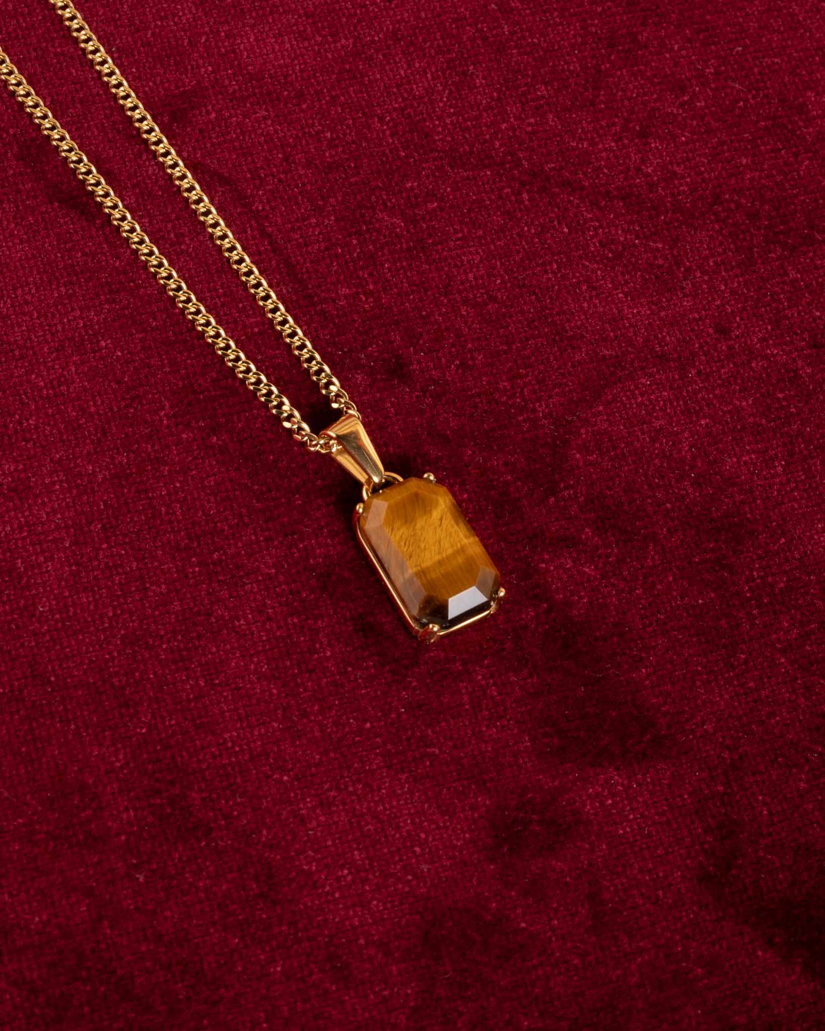 Halsband i guld med tigerögasten
